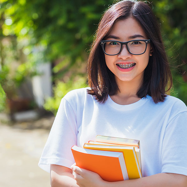Student with Glasses and Braces