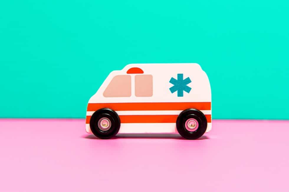 ambulance on blue and pink background